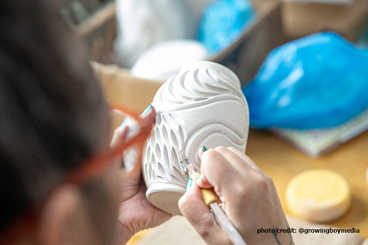 Close Up of Alice Carving a pot